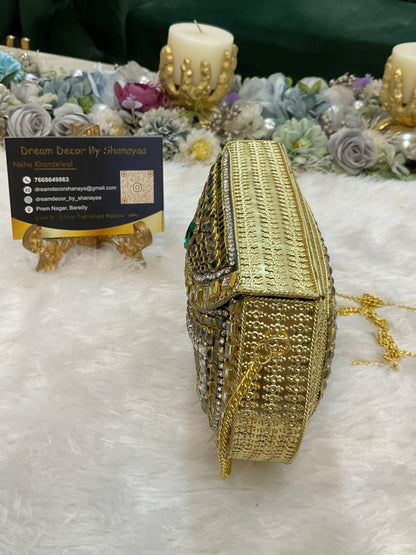 C. Emerald Green Designer Metal Clutch